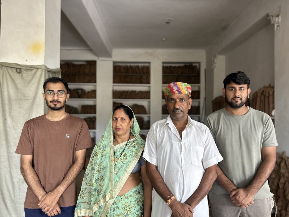 Mohit Kumhar with Kailash Devi, Dinesh Chandra Kumhar, and Umesh Kumhar in the Molela terracotta studio showroom