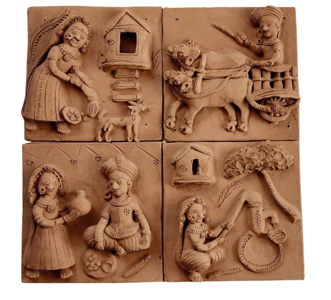 Set of four Molela terracotta plaques showing village tales