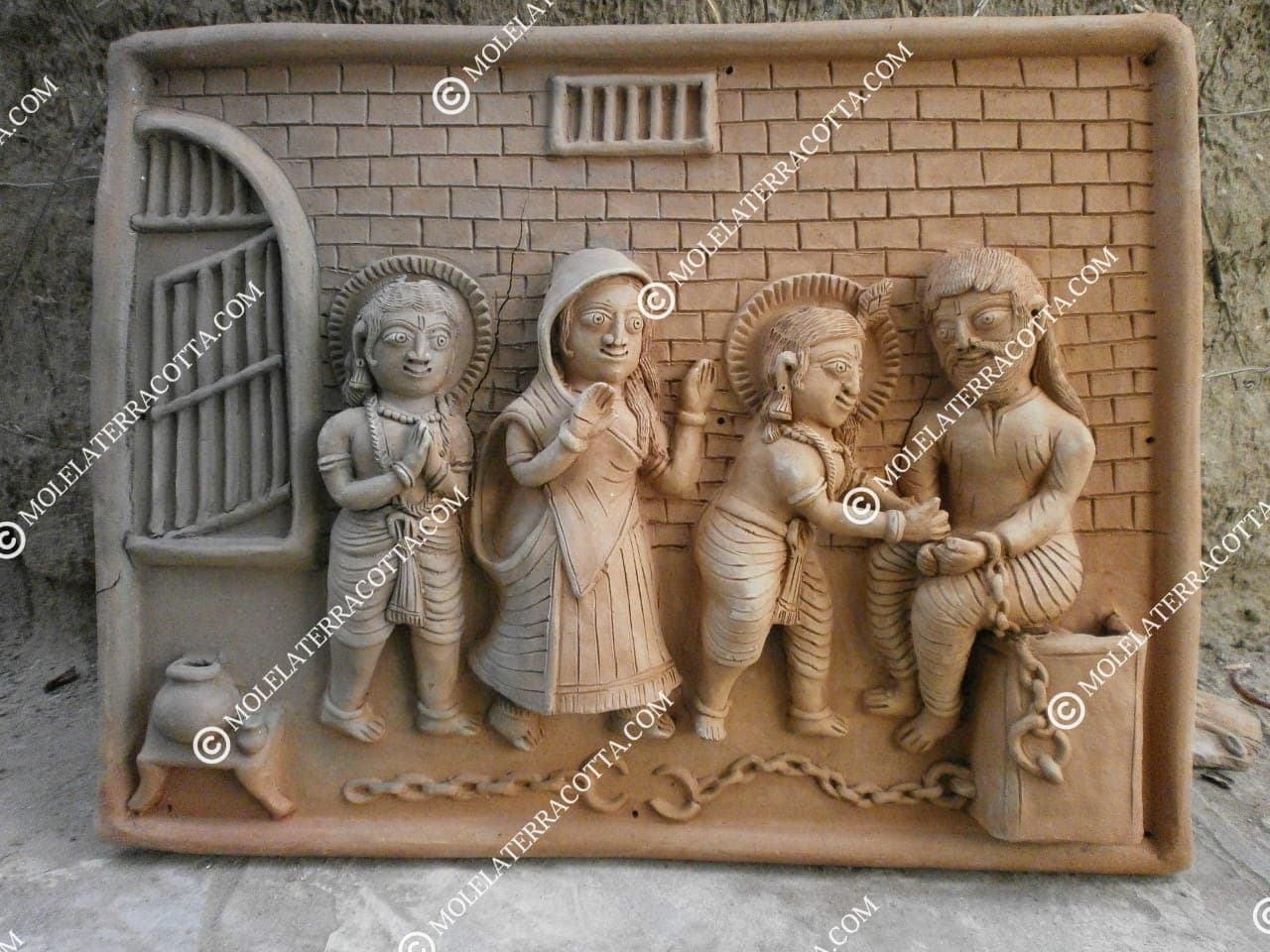 Molela terracotta wall decor tile with village figures in relief