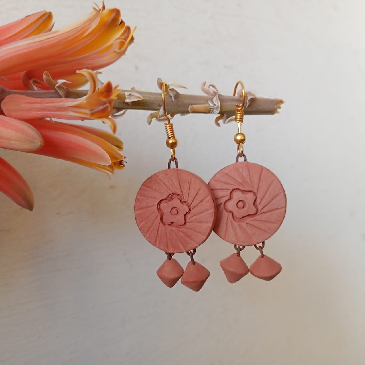 Floral medallion terracotta bell earrings