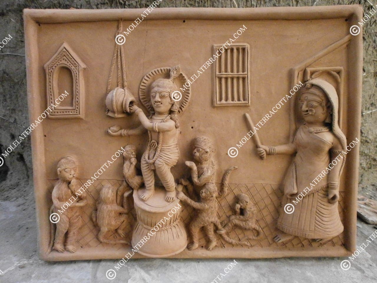 Molela clay wall plaque with Krishna, Yashoda, and monkeys in relief