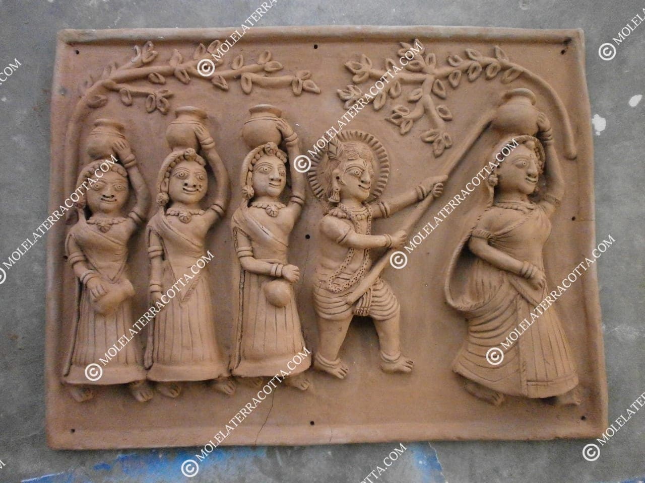 Molela terracotta wall hanging with Krishna and Gopis carrying pots in traditional folk style